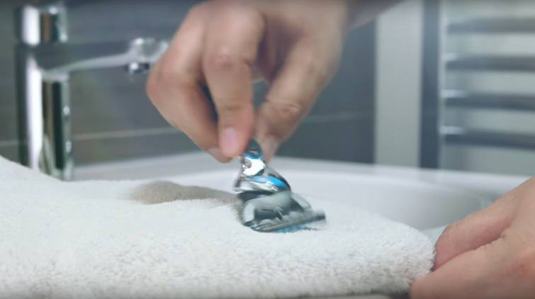 Wiping razor on towel