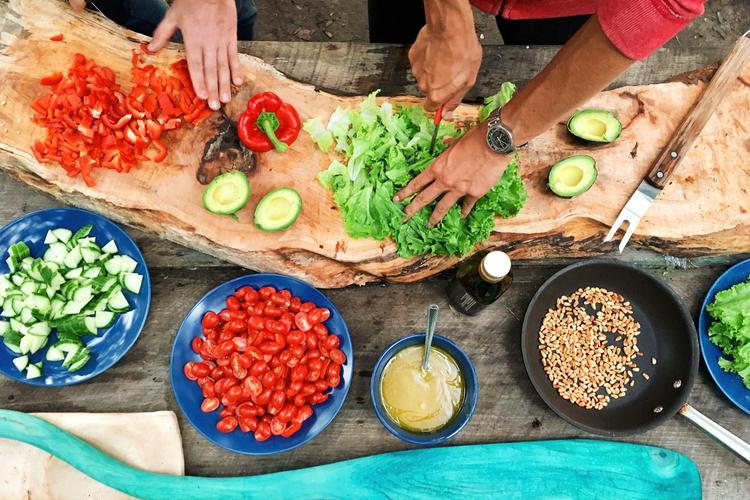 people prepping vegetables