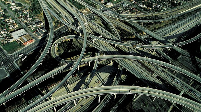 Yann Arthus Bertrand: a view of a sprawling mass of intersecting roads in Los Angeles from above.