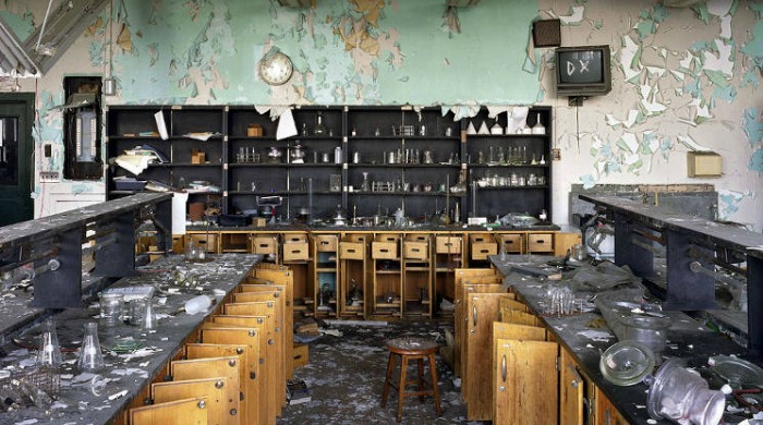 Ruins of Detroit Yves Marchand Romain Meffre: A laboratory with peeling walls and smashed glass utensils.