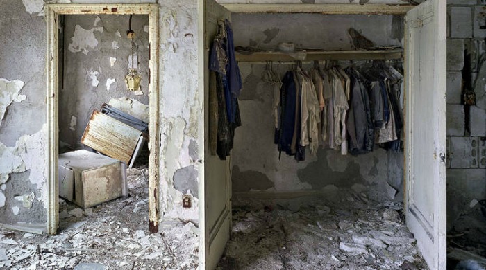 Ruins of Detroit Yves Marchand Romain Meffre: An abandoned room with an open wardrobe full of clothes and rubble littering the floor.