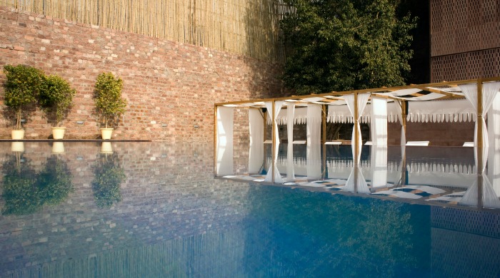 RAAS Jodphur: A walled-in pool with a shaded seating area.