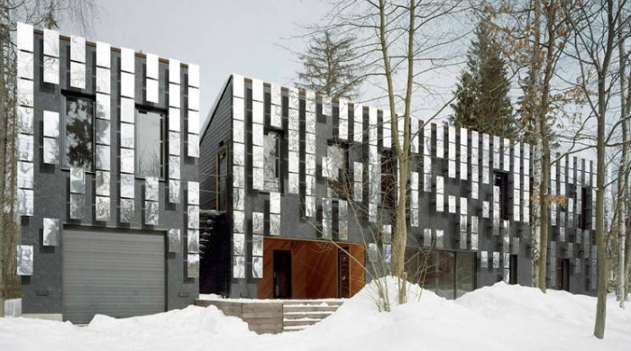 The front of Boris Bernaskoni's Villa Mirror Mongayt with snow covering the ground infront.