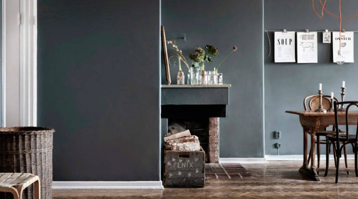 A room demonstrating the grey trend with grey walls and wooden flooring.