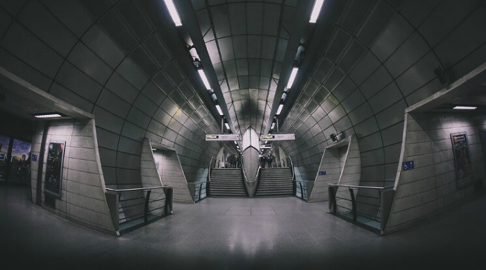 An empty modern walkway in the London Underground series by Mark Cornick.