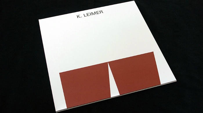 A minimalist record sleeve by Jelle Martens in white with two brown abstract squares on the front and the artist name 'K. Leimer' in black letters at the top.