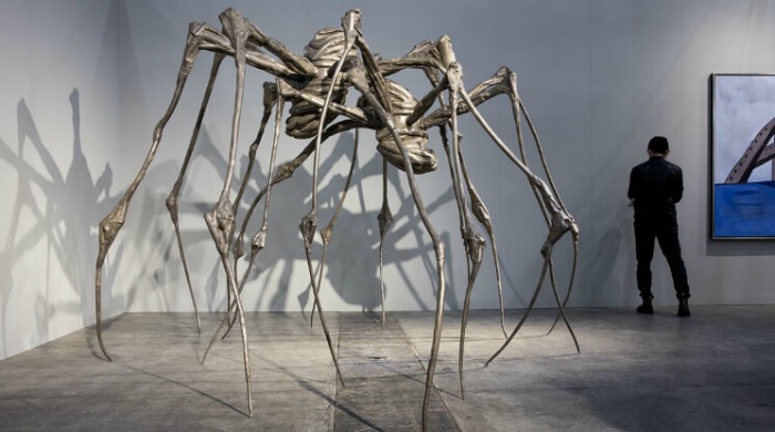 Louise Bourgeois’ 'Spider Couple' sculpture of two giant spiders at Art Basel Hong Kong 2016.