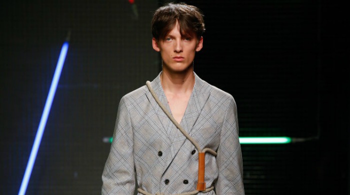 A male model wearing a grey MSGM jacket.