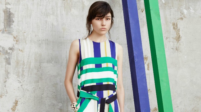 A model wearing a striped MSGM dress.