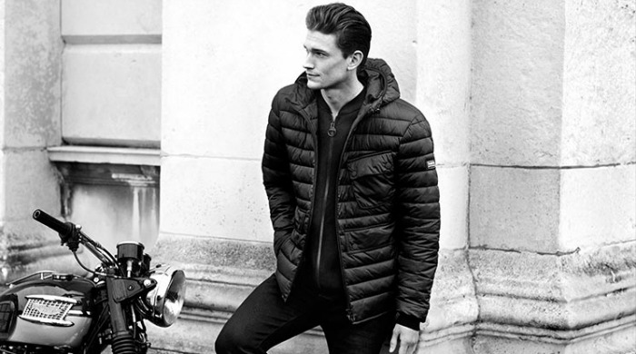 A male model wearing Barbour International clothing.