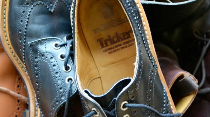 A pair of black Tricker's shoes.