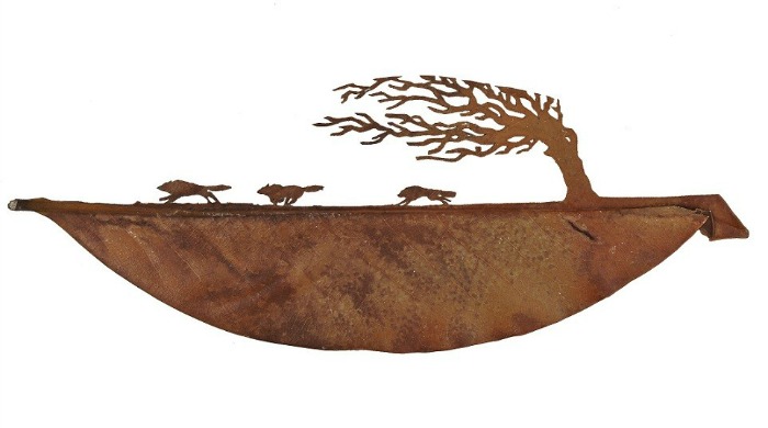 Leaf art depicting a pack of wolves running by Lorenzo Duran.