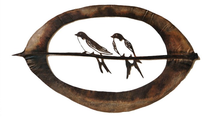 Leaf art depicting two birds on a branch by Lorenzo Duran.