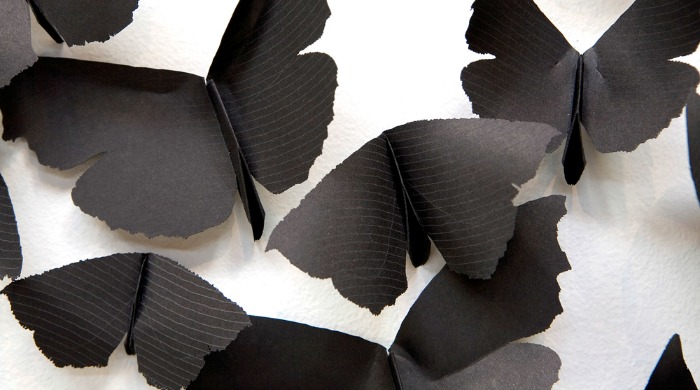 Black paper butterflies by Carlos Amorales.