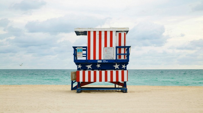 A stars and stripes Miami beach lookout tower photographed by Léo Caillard.