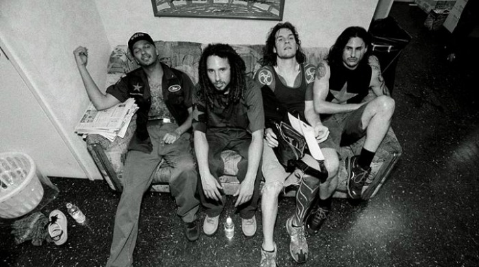 Rage Against the Machine sat on a sofa photographed by Danny Clinch.
