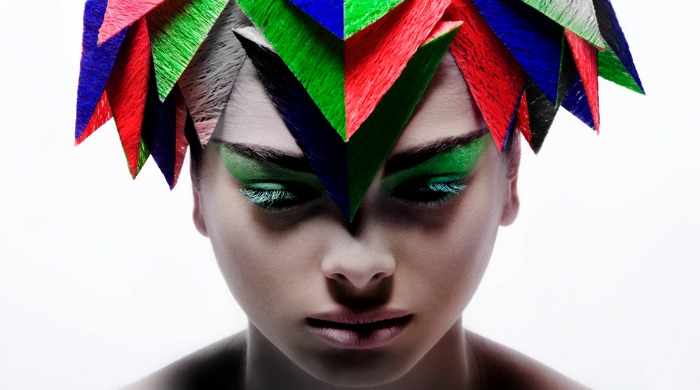 A woman with colourful triangles in her hair from 'Colour, Beauty and Geometry' by Billy Kidd.