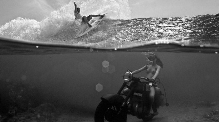 A topless woman riding a motorbike under the sea with a surfer on the surface from 'Dopamine' by Dustin Humphrey.