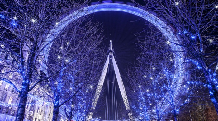 A photo of the London Eye lit up by Aaron Hargreaves.