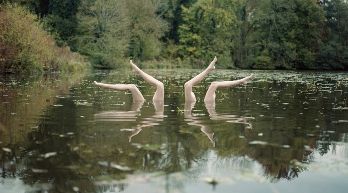 Mannequin legs posed in a lake by Jean-Baptiste Courtier.