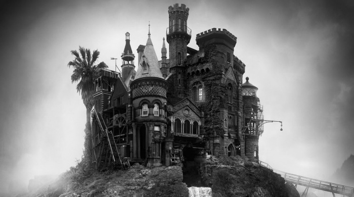 A large house on top of a waterfall in black and white by Jim Kazanjian.