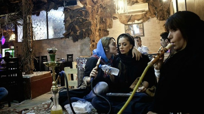 Women smoking indoors by Hossein Fatemi.