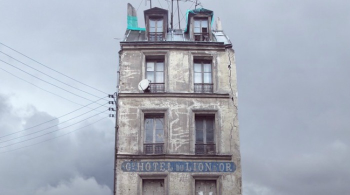 A tall, old, derelict hotel in the sky from 'Flying Houses' by Laurent Chehere.