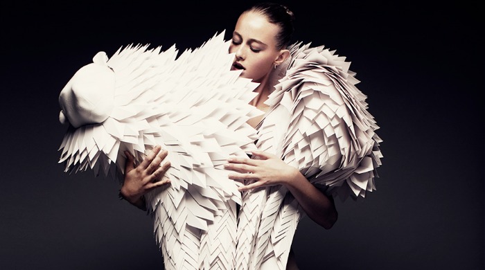 A model wearing a 3D, textured paper animal around her shoulders by Bea Szenfeld.