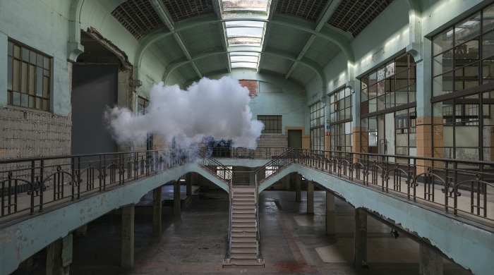 A cloud floating in a derelict factory by Berndnaut Smilde.