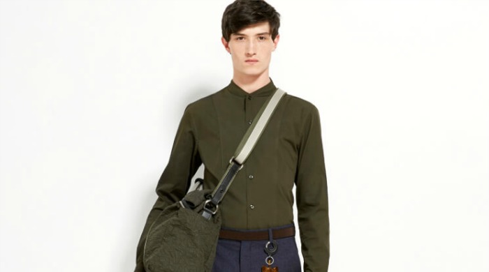 A male model wearing Carven clothing.