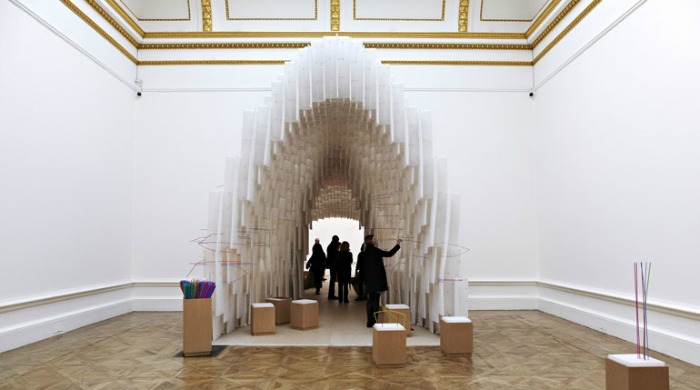 A structure in a large exhibition space at the Royal Academy of the Arts.