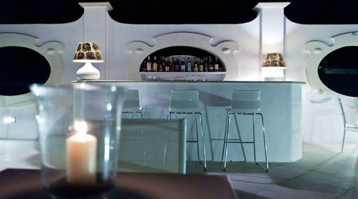 The outdoor bar lit up at night at the La Settima Luna Hotel, Lipari.
