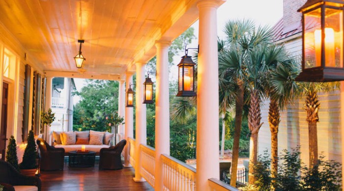 A porch with hanging lanterns in the Zero George Street Hotel, Charleston.