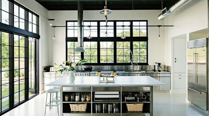 The kitchen in an industrial Portland loft with metallic accents.