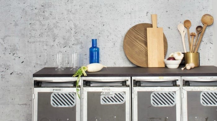 Kitchen surfaces inside a Berlin apartment with wooden cooking utensils.