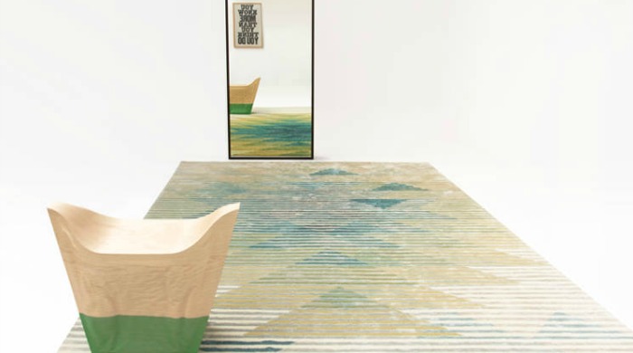 An op-art rug from The Lake collection reflected in a mirror.