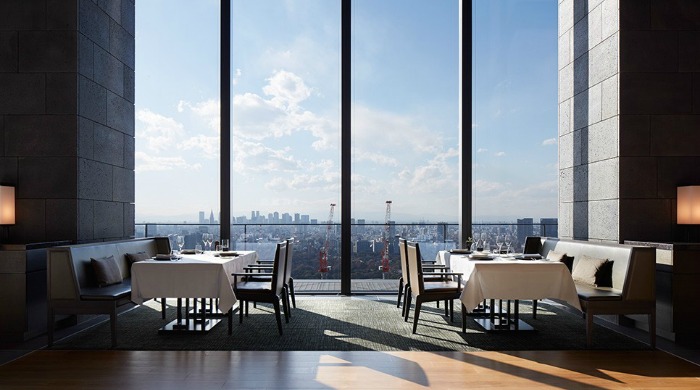 A dining room with views over the city in Aman Tokyo.