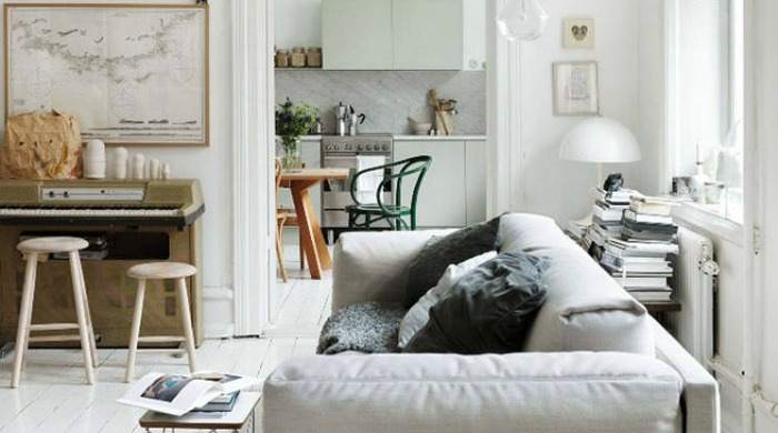A living room with a grey sofa from Apartment Therapy.