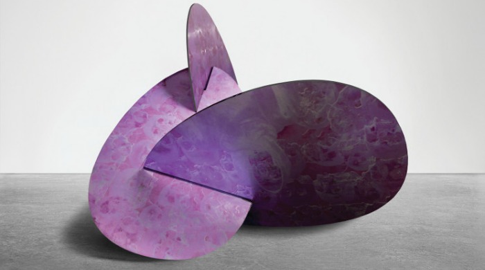 A pink and purple metal sculpture by Andrew Levitas.