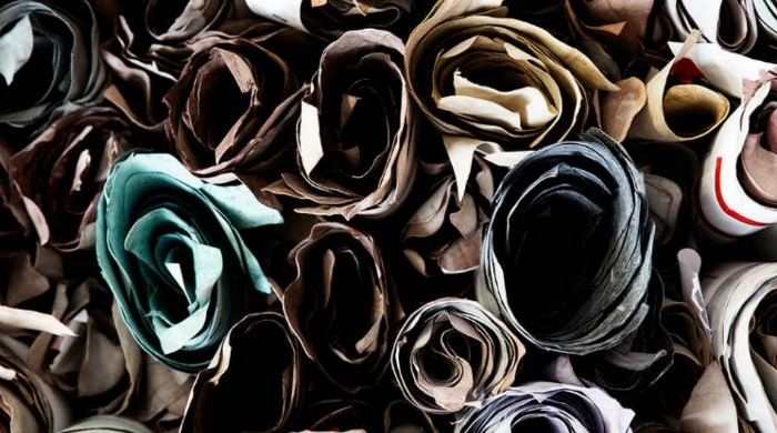 Rolls of different coloured leather at an Italian leather factory.
