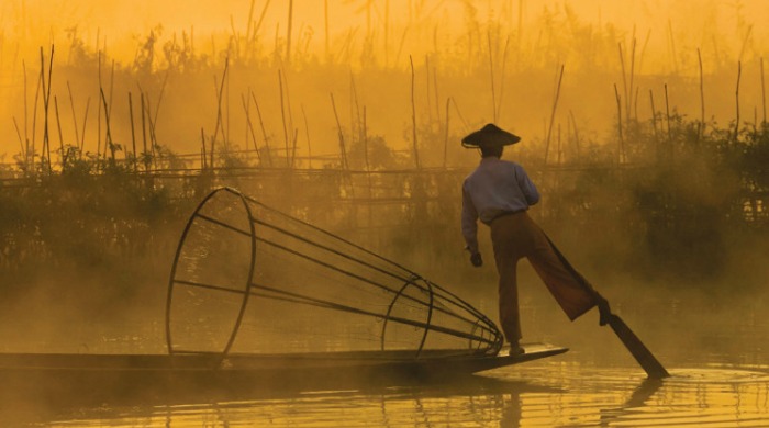 A Burmese man on a fishing boat.
