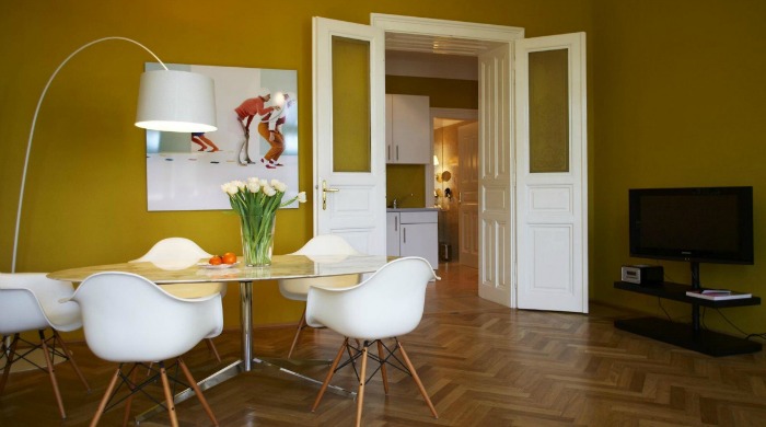 A yellow dining area in Hotel Altstadt, Vienna.