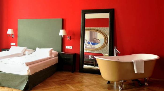 A red bedroom in Hotel Altstadt, Vienna.