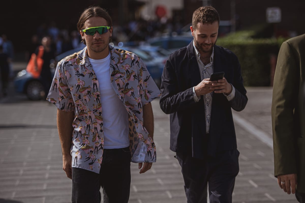 Two men wearing printed shirts